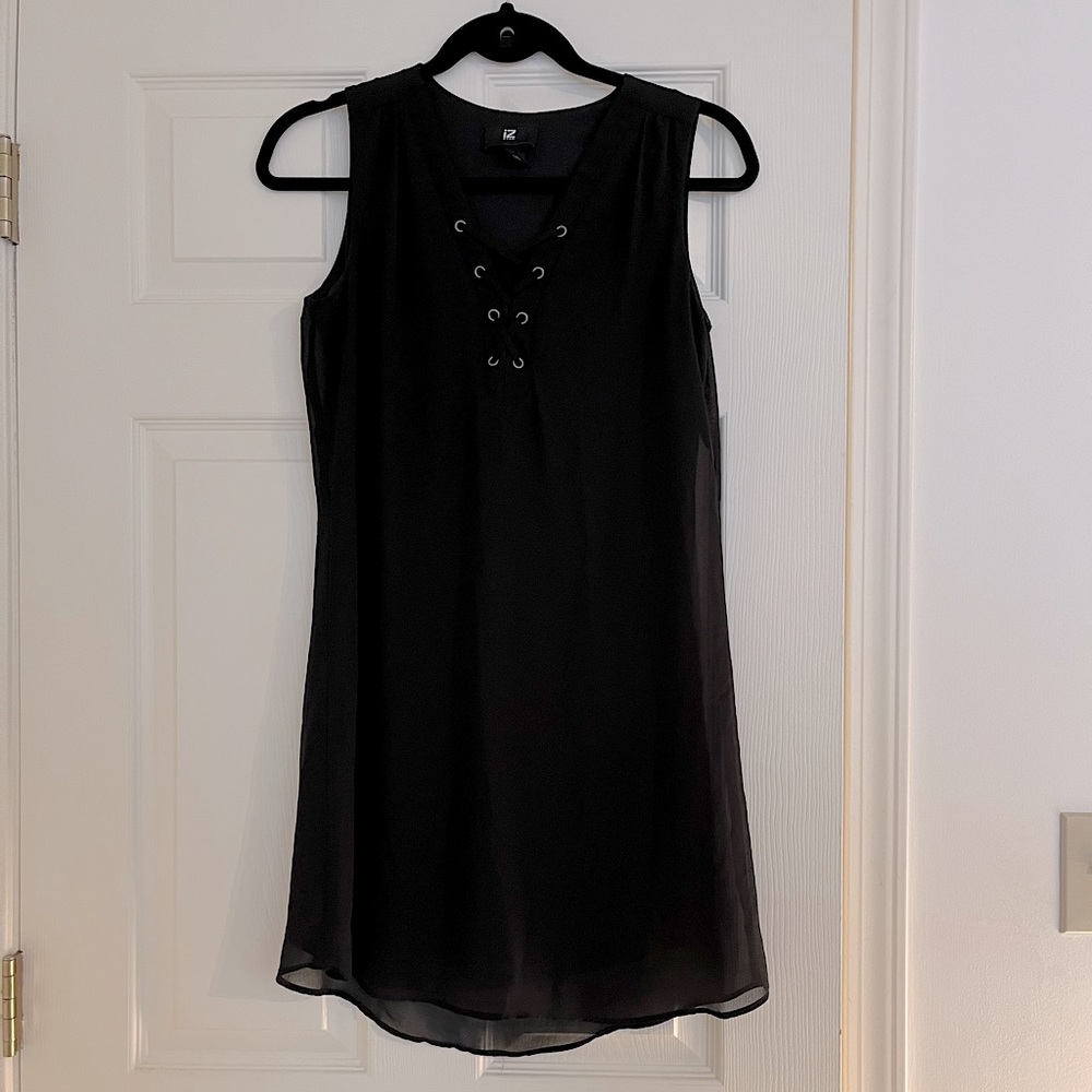 Black sleeveless crisscross minidress